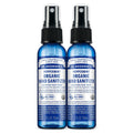 Two blue 2 fl oz bottles of Dr. Bronners Peppermint Organic Hand Sanitizer with spray tops, labeled as certified fair trade. Text reads FAMILY SOAPMAKERS SINCE 1858, PEPPERMINT ORGANIC HAND SANITIZER, CERTIFIED FAIR TRADE, and ALL ONE Ideal for eco friendly hygiene